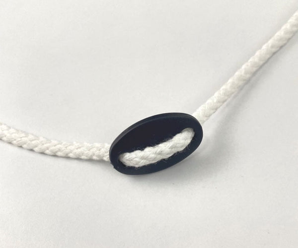 Topes para cordones de plástico ovalados StrapRyte® - 100 unidades